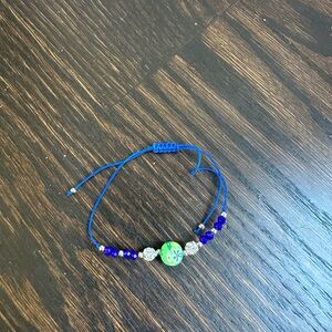 Blue Beaded Adjustable Bracelet with Floral Accent